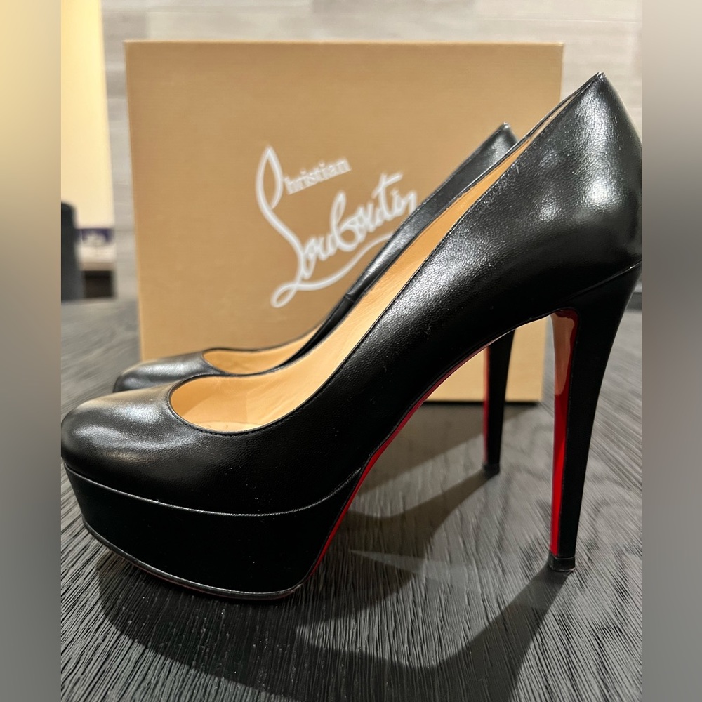 “Christian Louboutin” black leather platform pumps